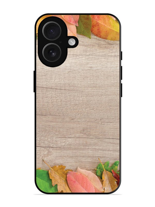 iPhone 16 Autumn Leafs On Wooden Table
